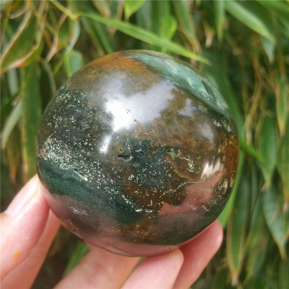 Crystal carved ball of Ocean Jasper