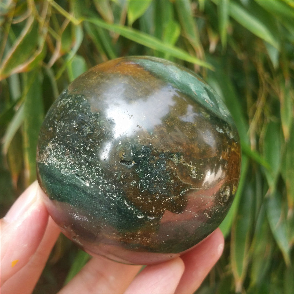Crystal carved ball of Ocean Jasper