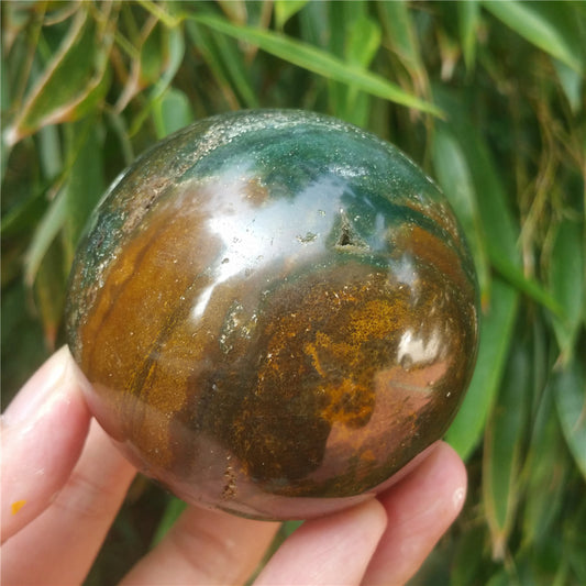 Crystal carved ball of Ocean Jasper