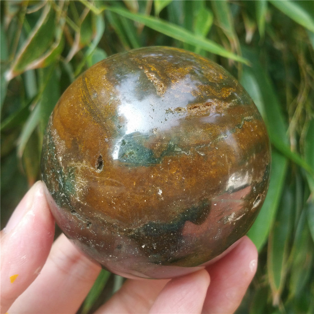 Crystal carved ball of Ocean Jasper