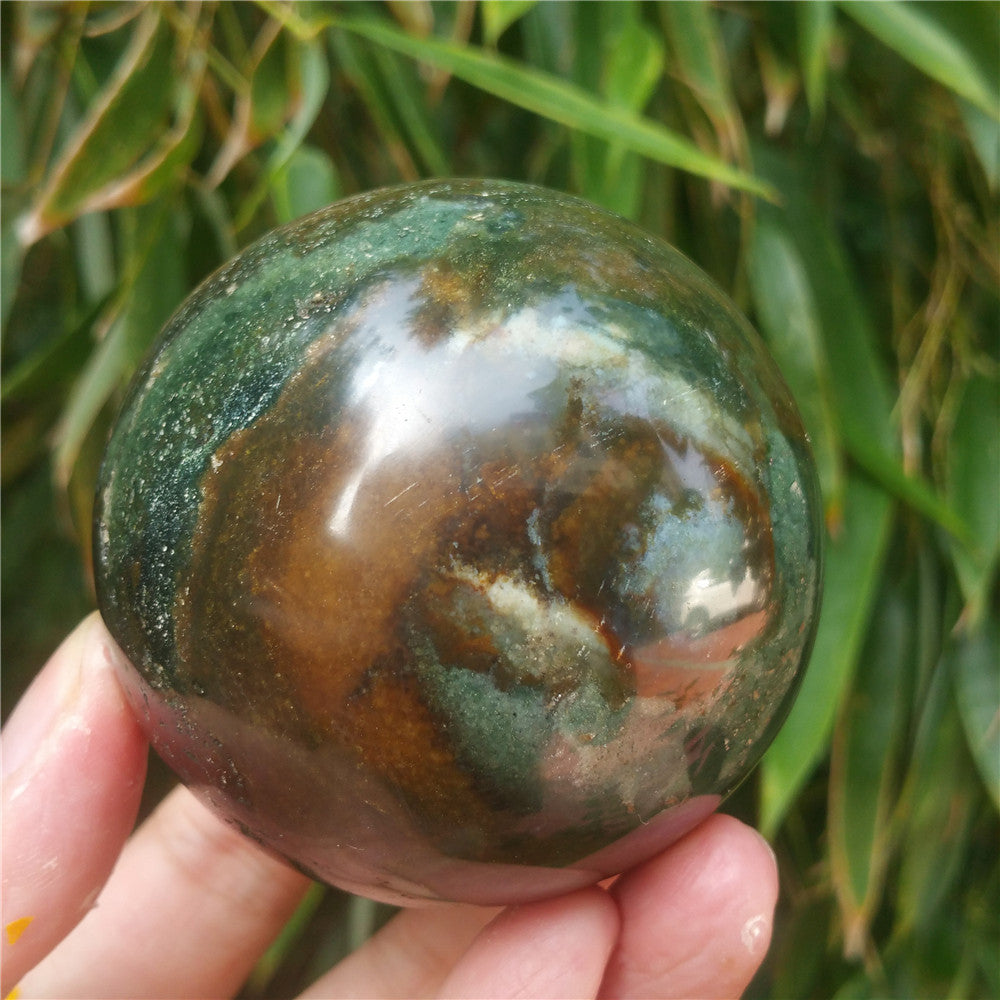 Crystal carved ball of Ocean Jasper