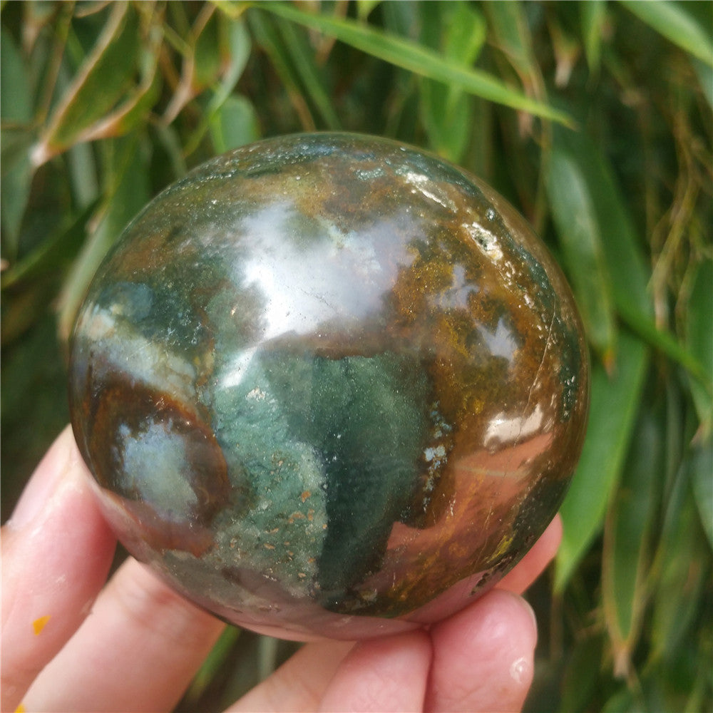 Crystal carved ball of Ocean Jasper