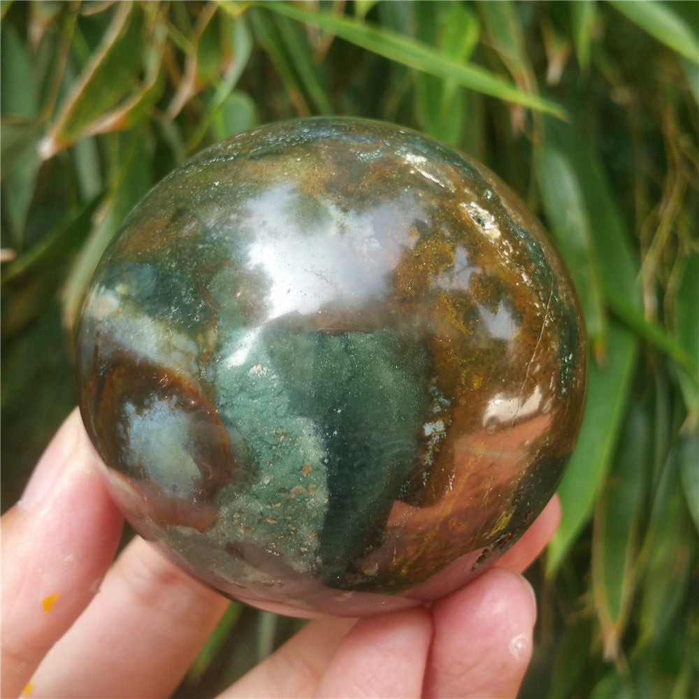 Crystal carved ball of Ocean Jasper