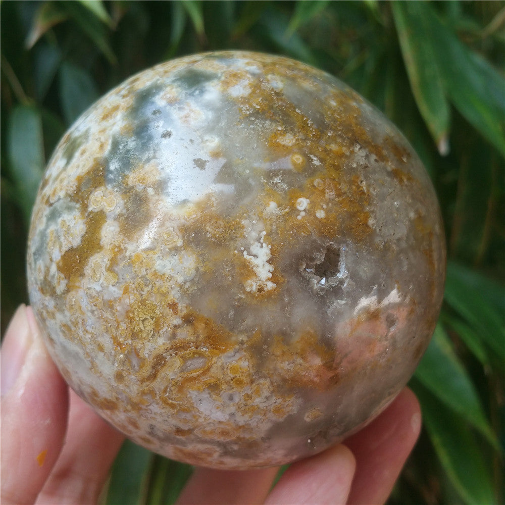 Crystal carved ball of Ocean Jasper