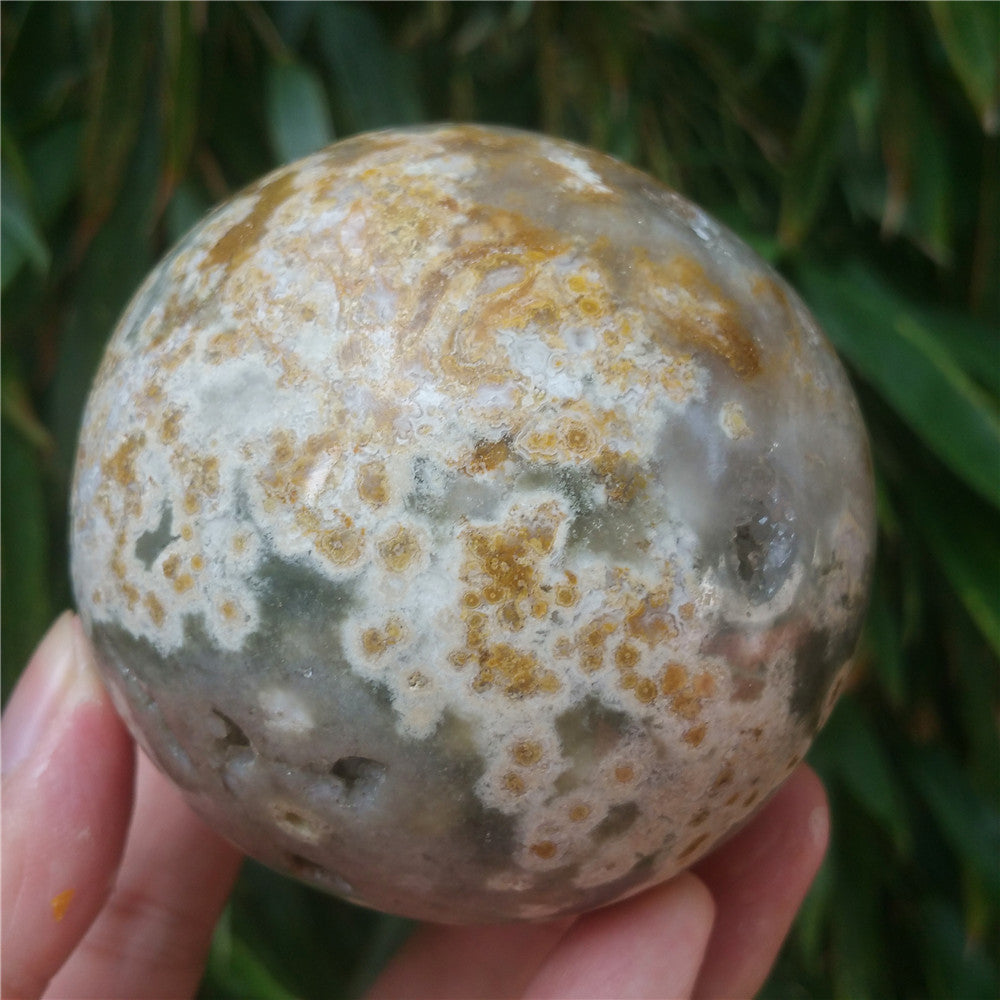 Crystal carved ball of Ocean Jasper