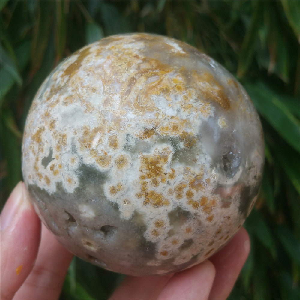Crystal carved ball of Ocean Jasper
