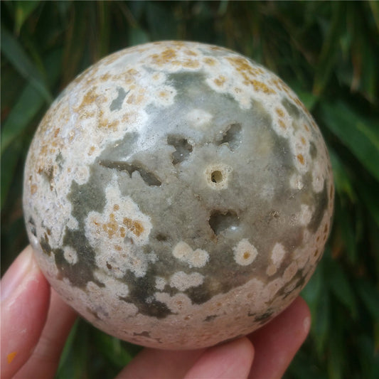 Crystal carved ball of Ocean Jasper