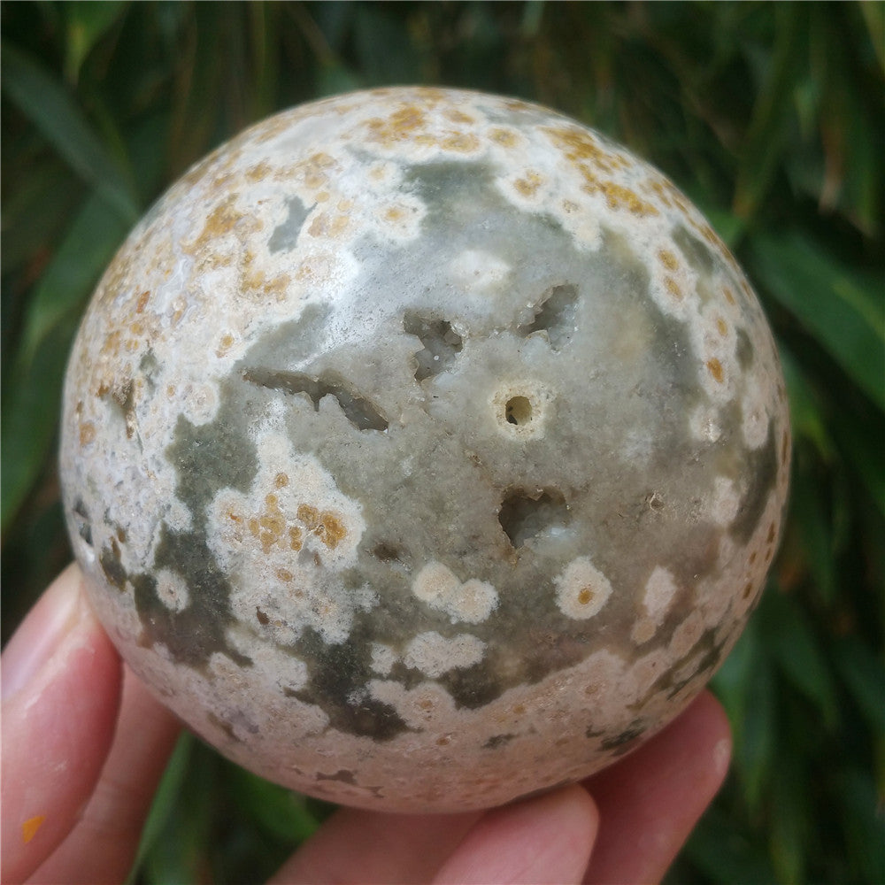 Crystal carved ball of Ocean Jasper