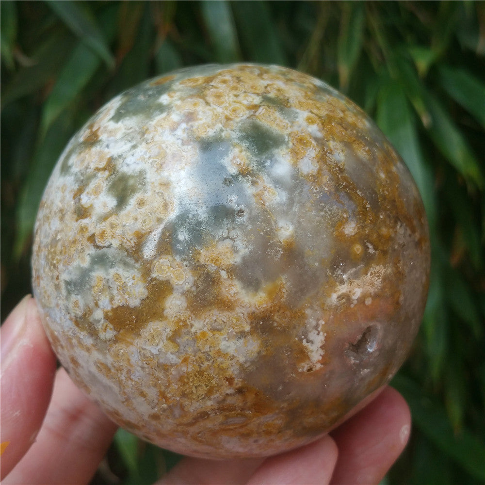 Crystal carved ball of Ocean Jasper