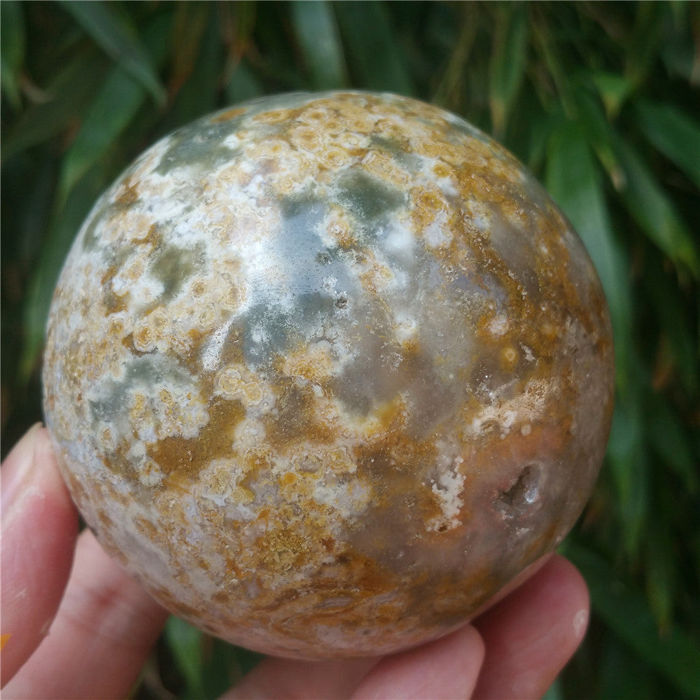 Crystal carved ball of Ocean Jasper