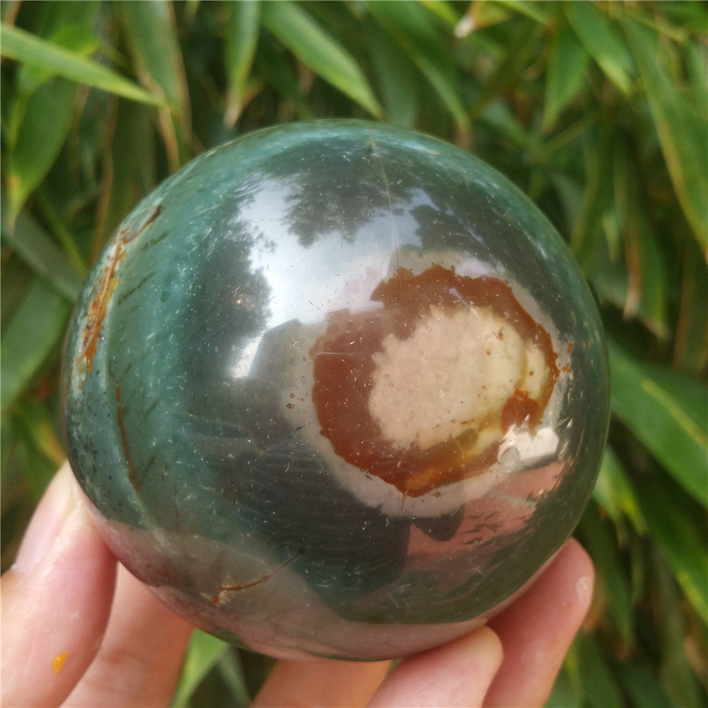 Crystal carved ball of Ocean Jasper