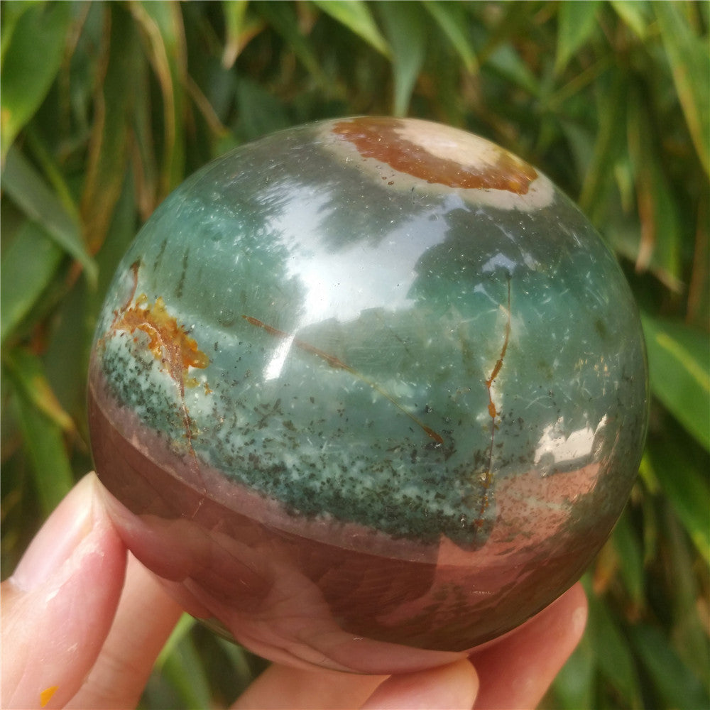 Crystal carved ball of Ocean Jasper