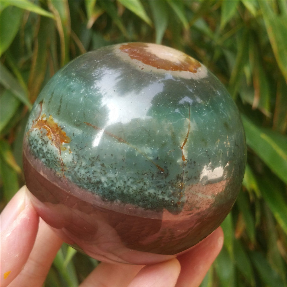 Crystal carved ball of Ocean Jasper
