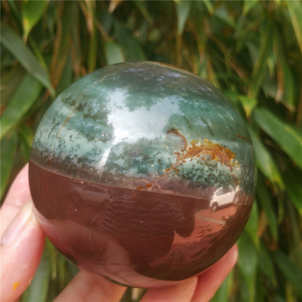 Crystal carved ball of Ocean Jasper