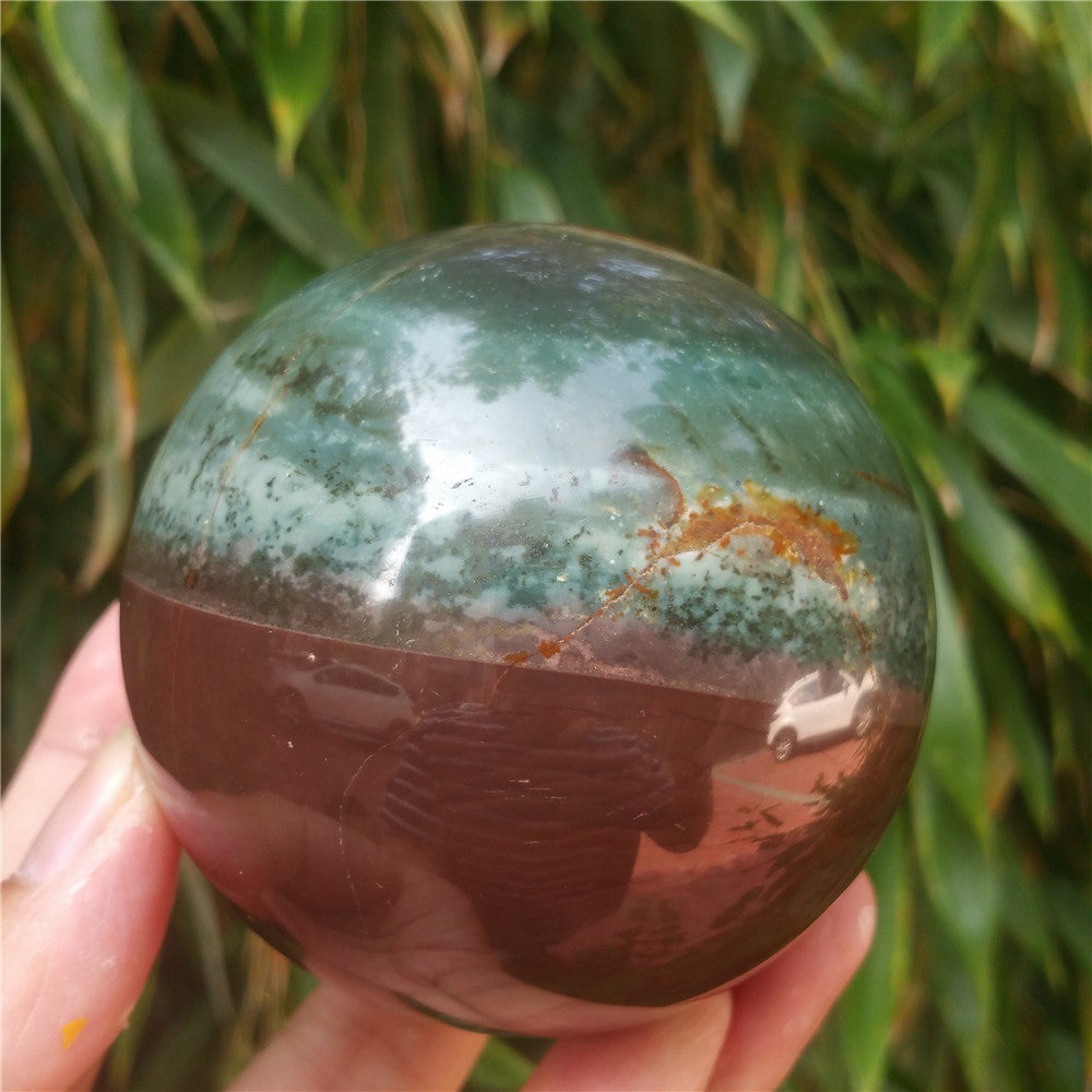 Crystal carved ball of Ocean Jasper