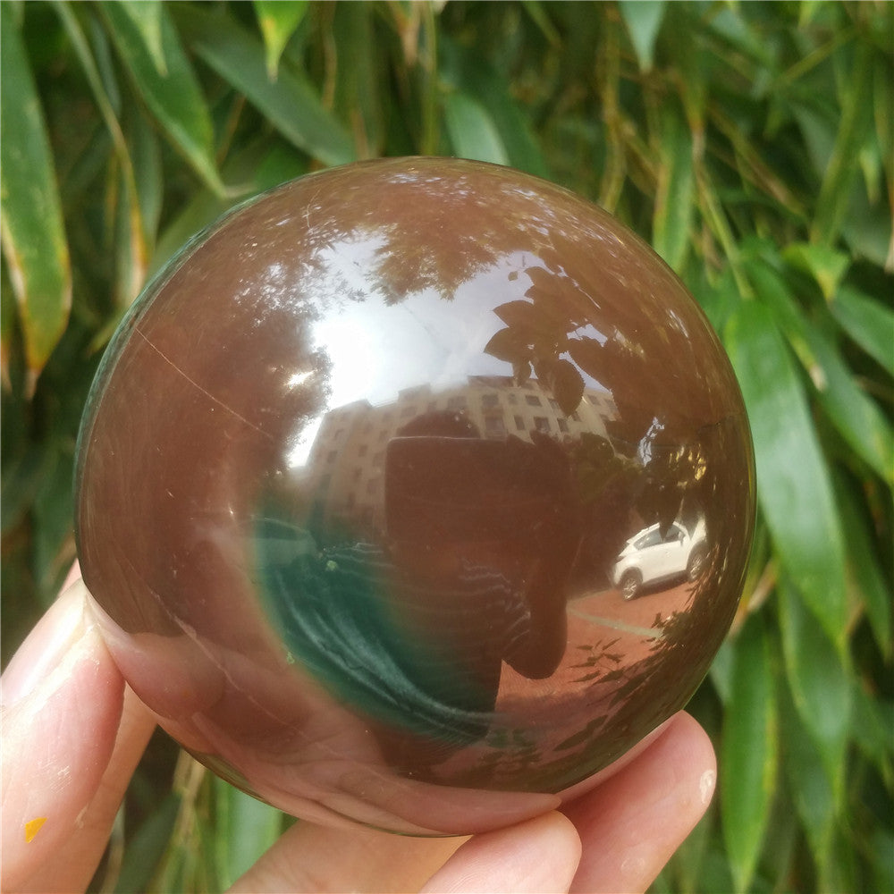 Crystal carved ball of Ocean Jasper