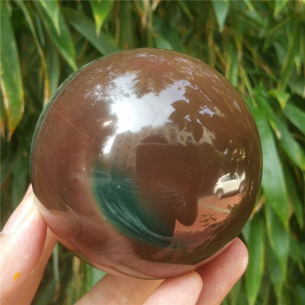Crystal carved ball of Ocean Jasper