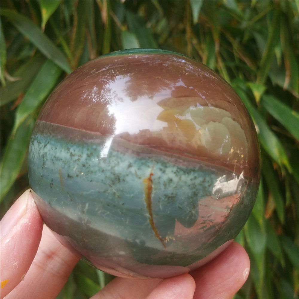 Crystal carved ball of Ocean Jasper