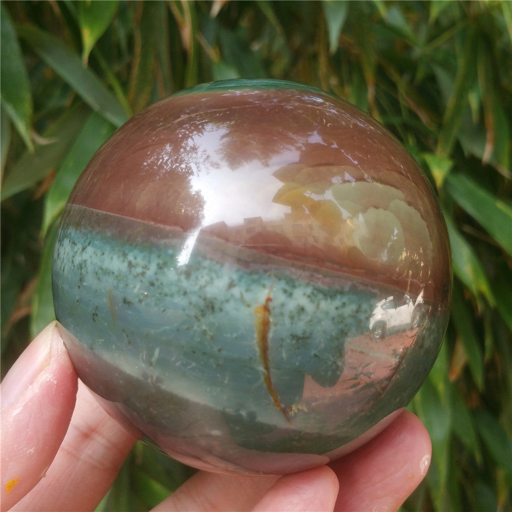 Crystal carved ball of Ocean Jasper