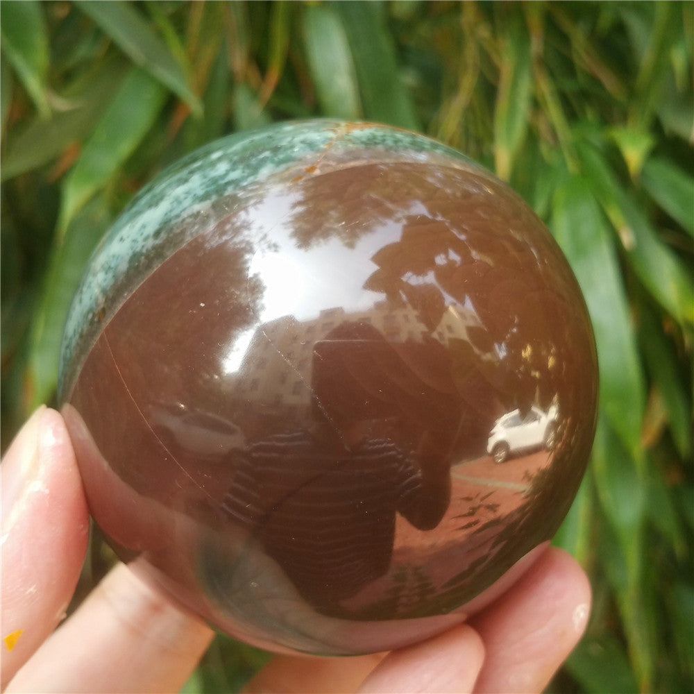 Crystal carved ball of Ocean Jasper