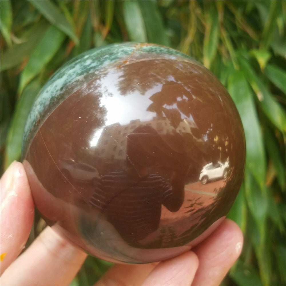 Crystal carved ball of Ocean Jasper