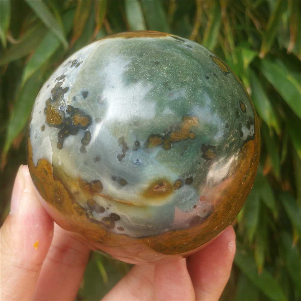 Crystal carved ball of Ocean Jasper