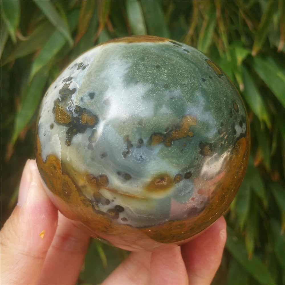 Crystal carved ball of Ocean Jasper