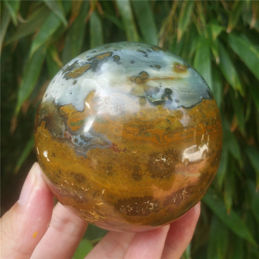 Crystal carved ball of Ocean Jasper