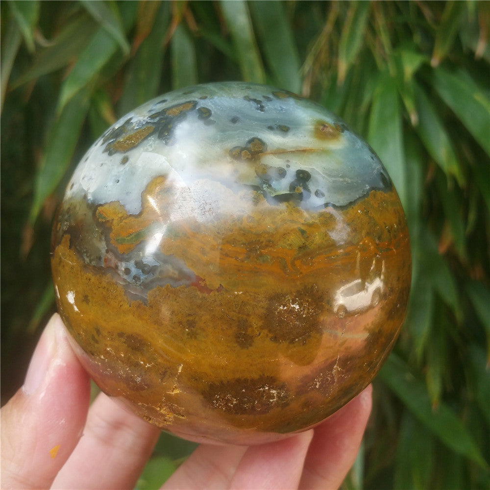 Crystal carved ball of Ocean Jasper