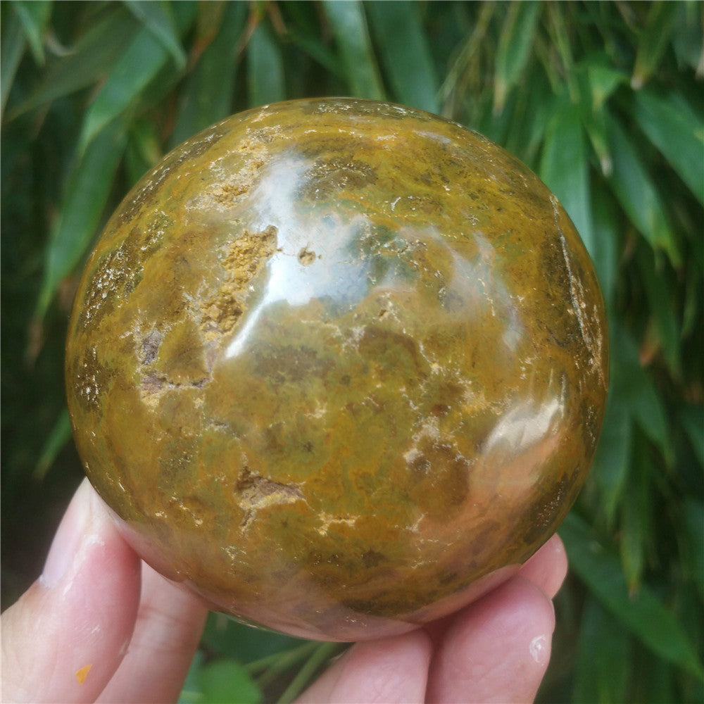 Crystal carved ball of Ocean Jasper