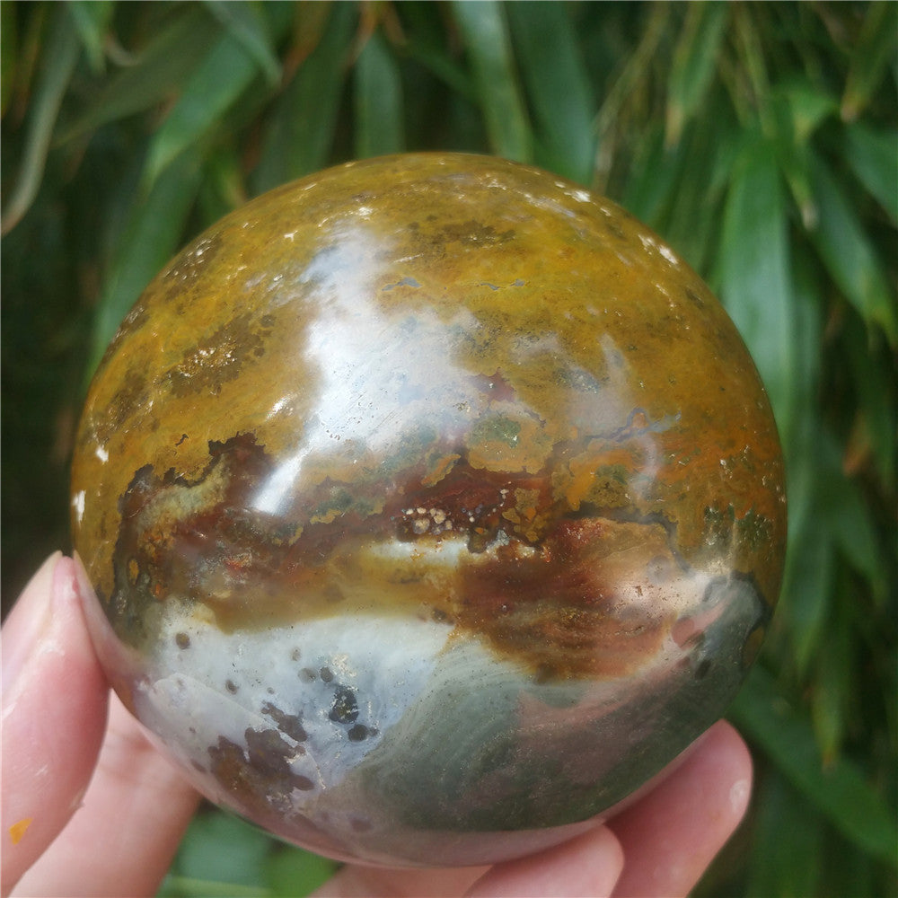 Crystal carved ball of Ocean Jasper