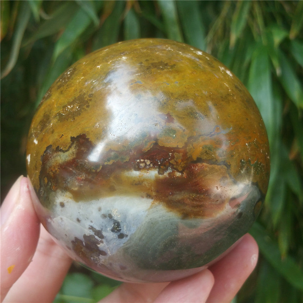 Crystal carved ball of Ocean Jasper