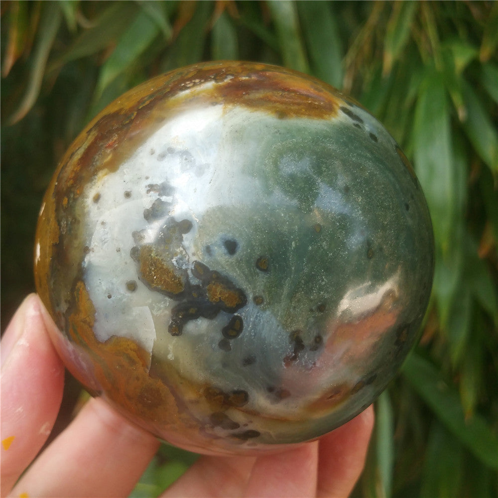 Crystal carved ball of Ocean Jasper