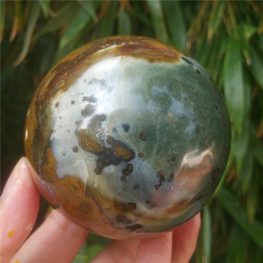 Crystal carved ball of Ocean Jasper