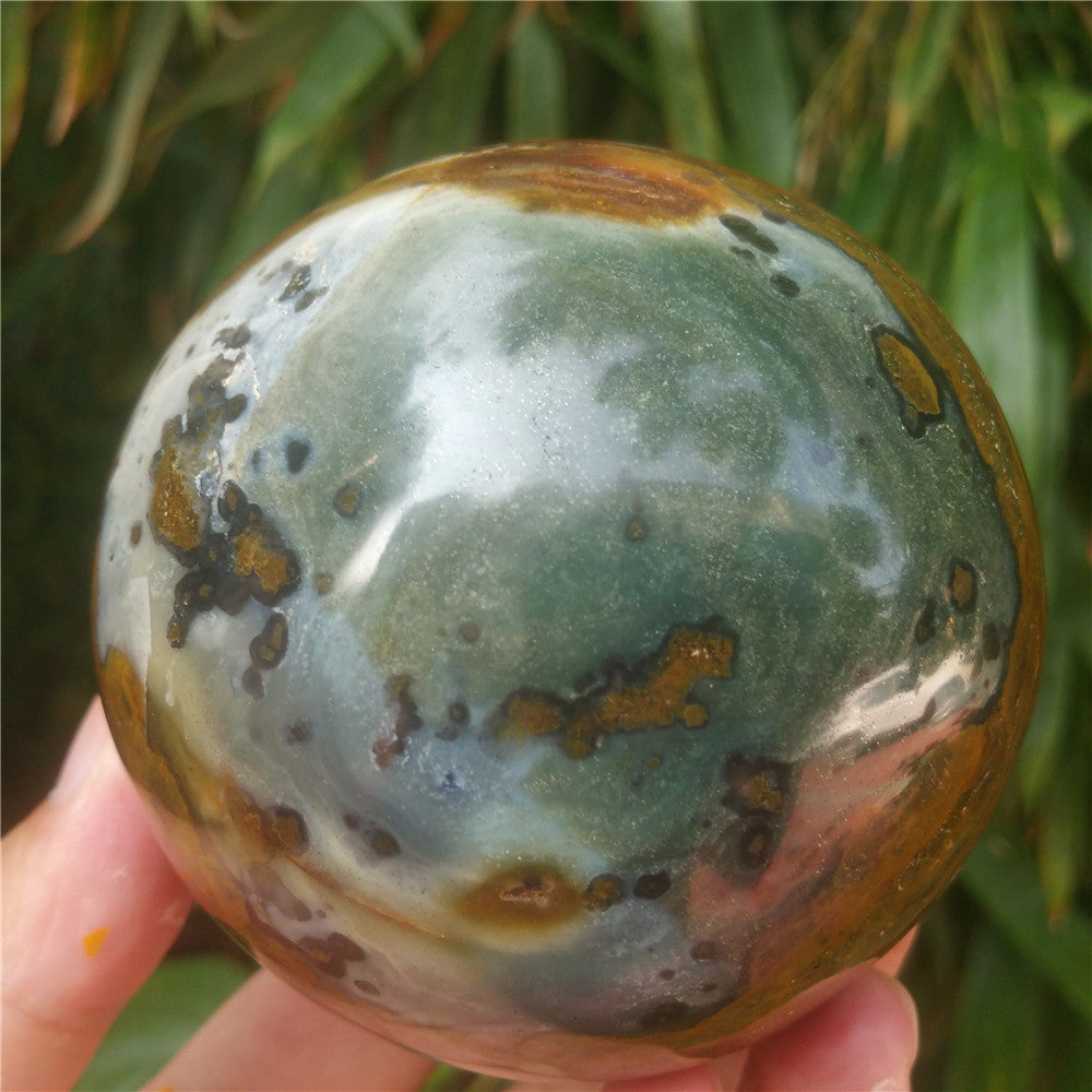Crystal carved ball of Ocean Jasper