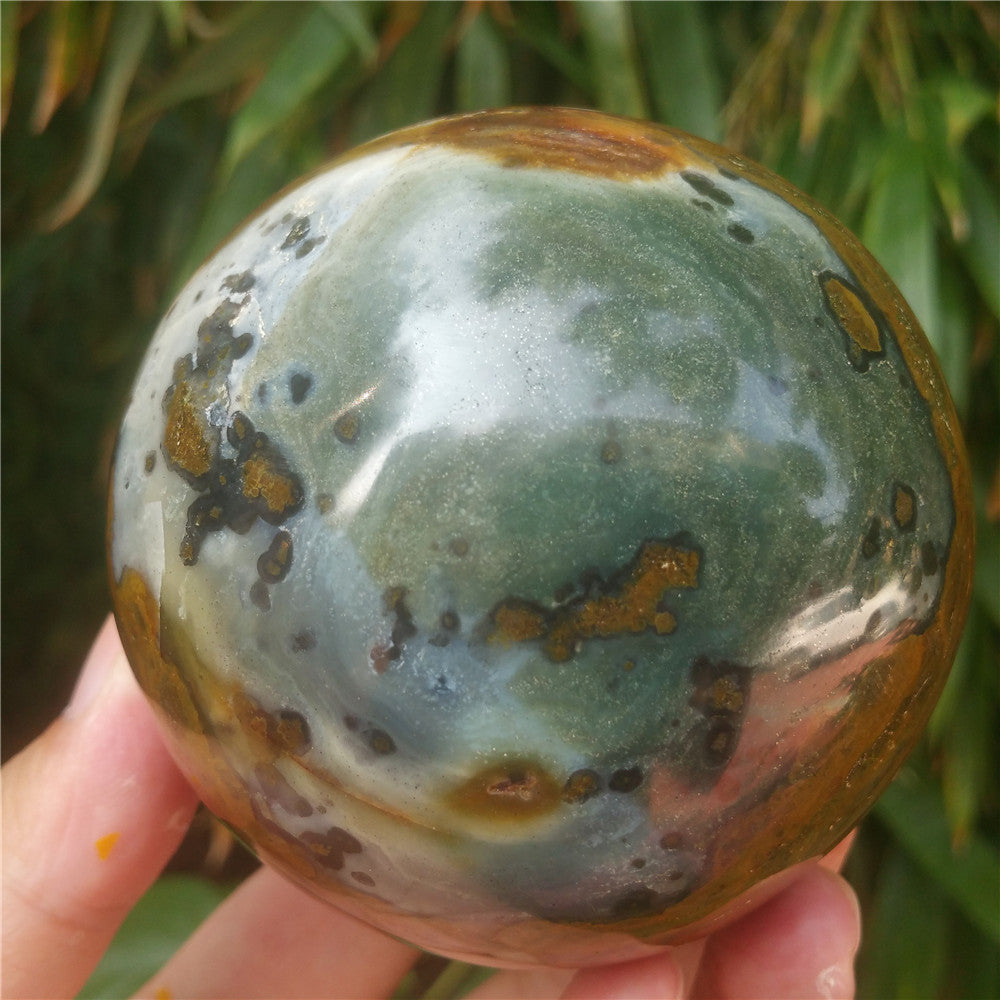 Crystal carved ball of Ocean Jasper