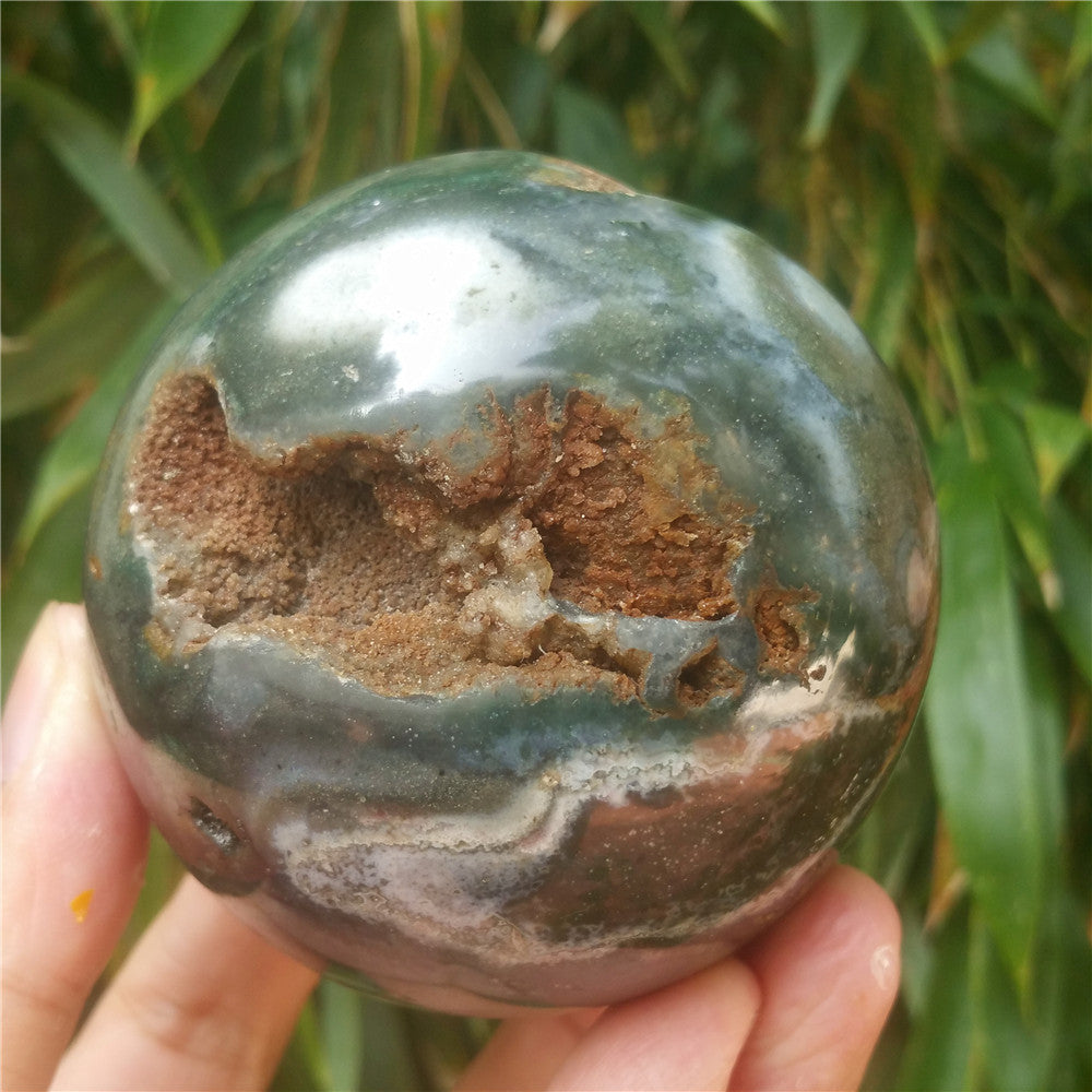 Crystal carved ball of Ocean Jasper