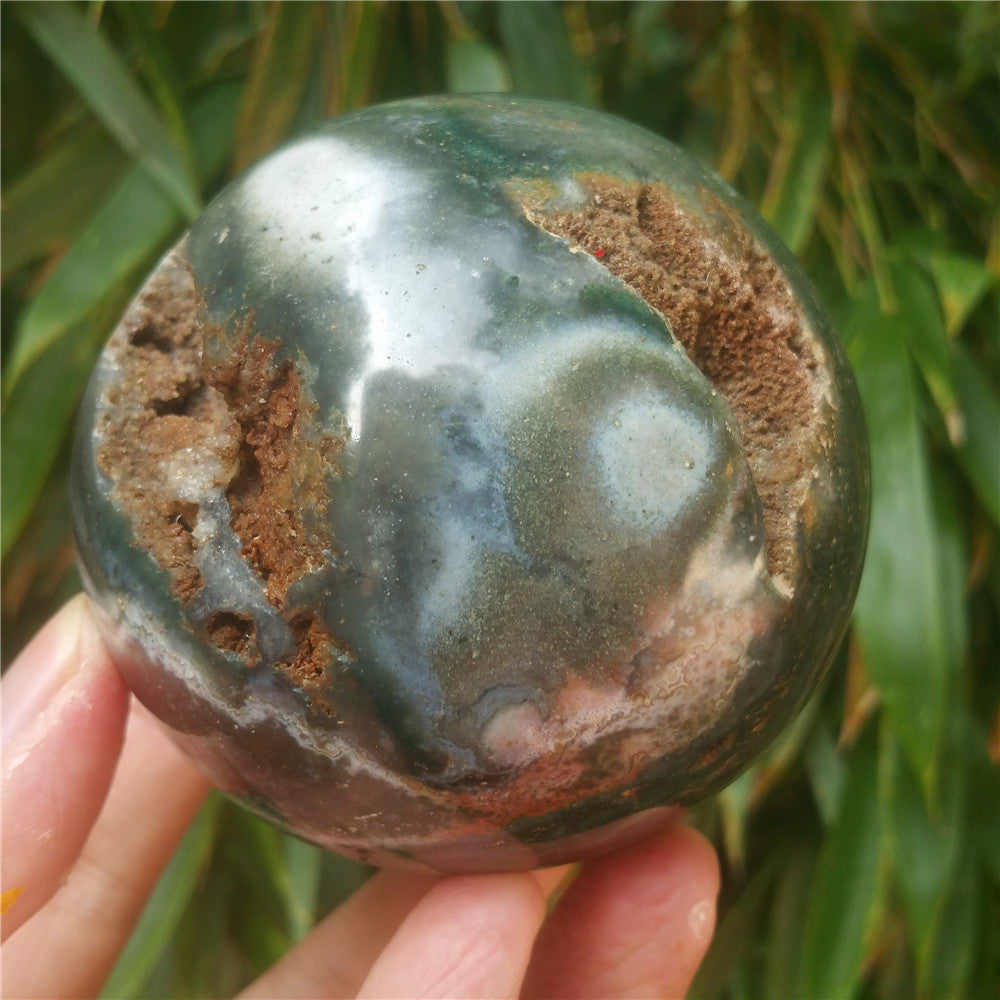 Crystal carved ball of Ocean Jasper