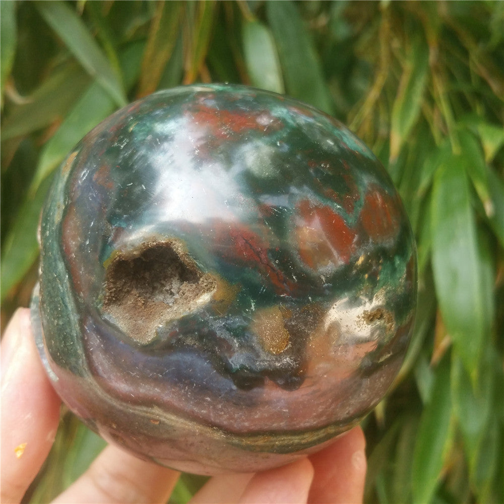 Crystal carved ball of Ocean Jasper