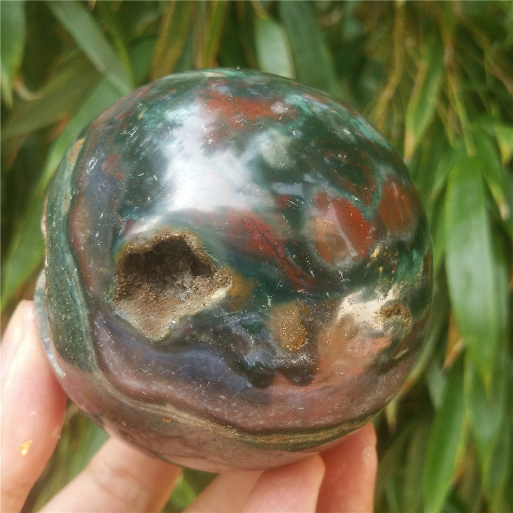 Crystal carved ball of Ocean Jasper
