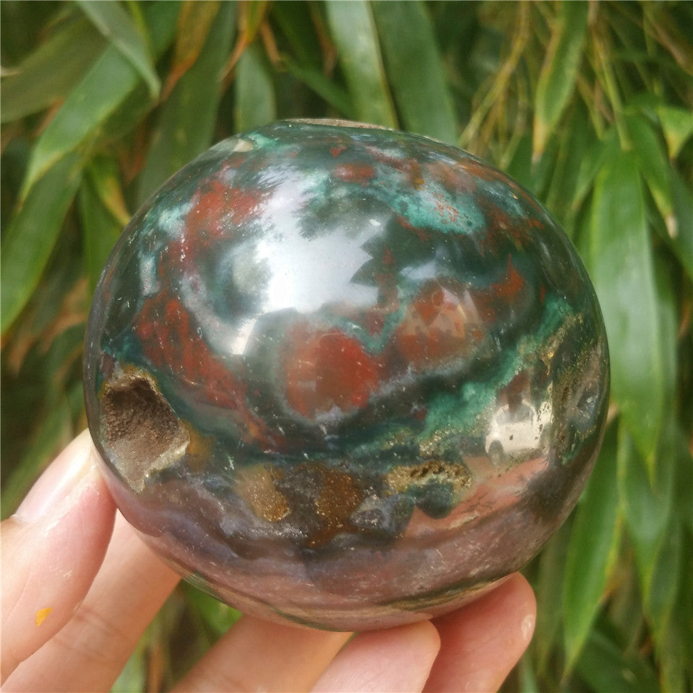 Crystal carved ball of Ocean Jasper