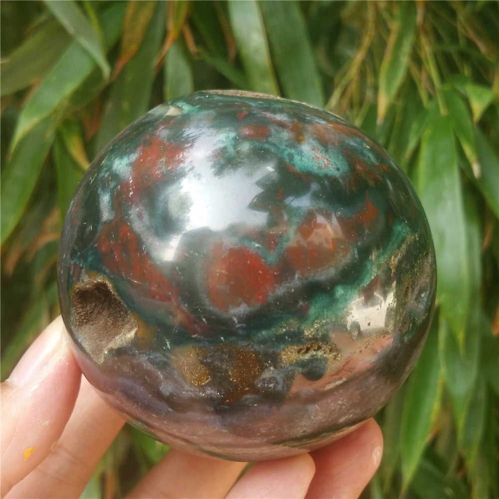Crystal carved ball of Ocean Jasper