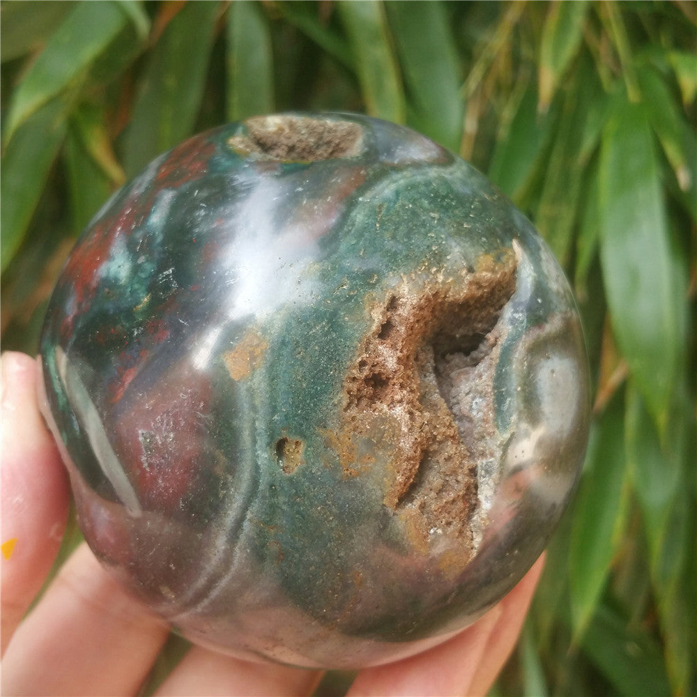 Crystal carved ball of Ocean Jasper
