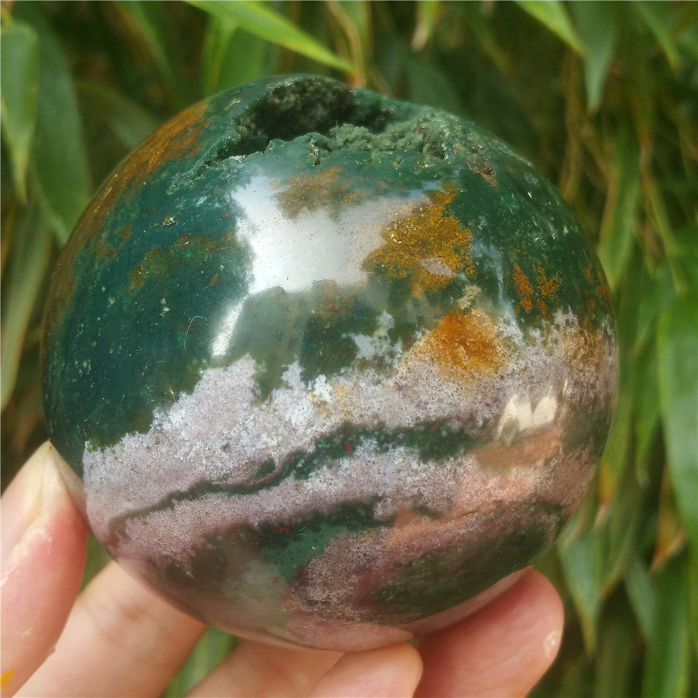 Crystal carved ball of Ocean Jasper