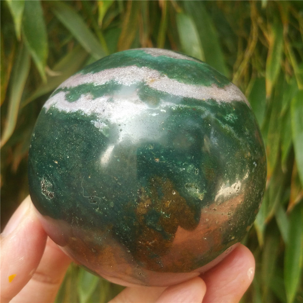 Crystal carved ball of Ocean Jasper
