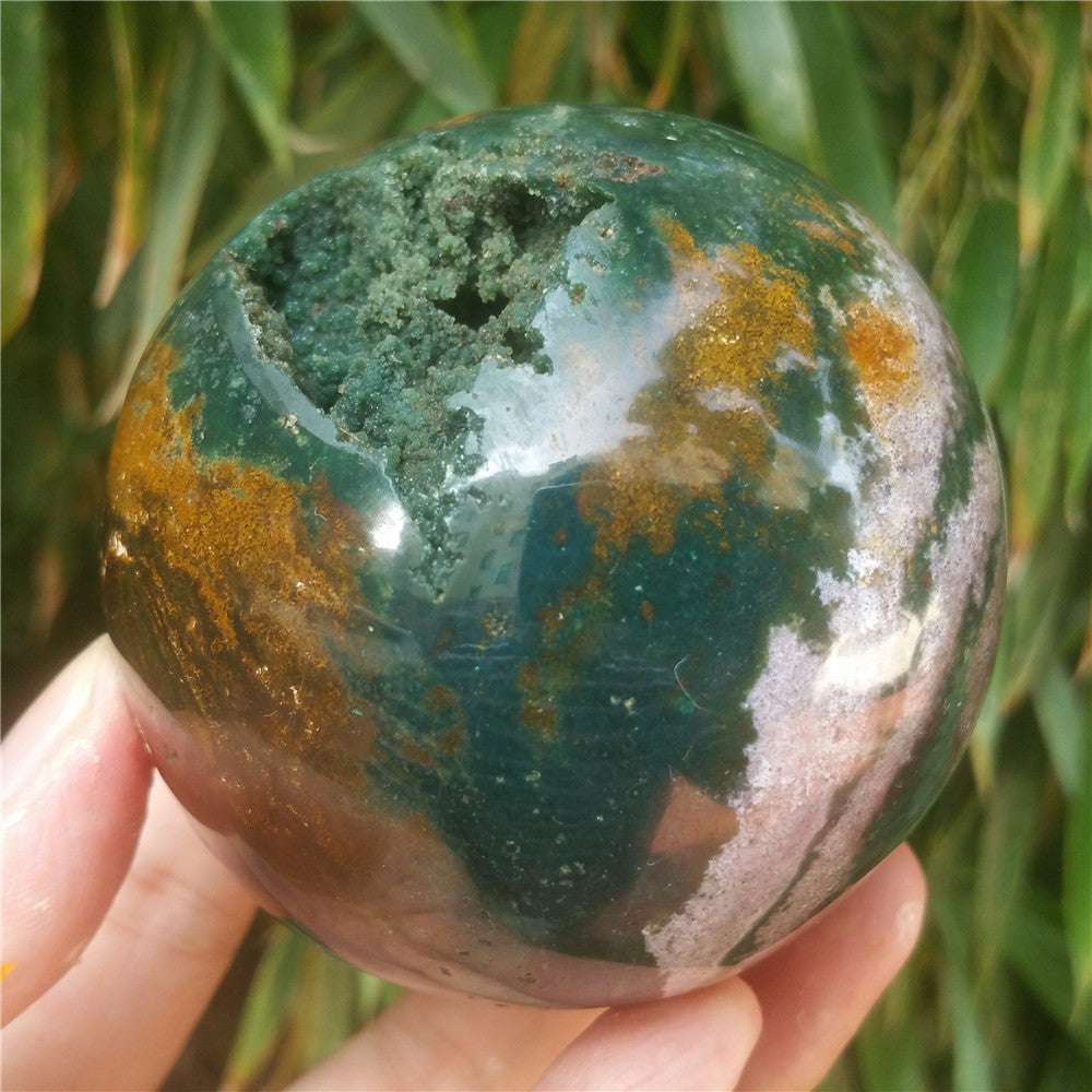 Crystal carved ball of Ocean Jasper