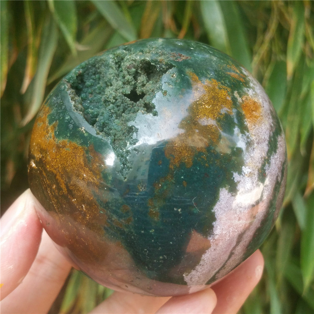 Crystal carved ball of Ocean Jasper