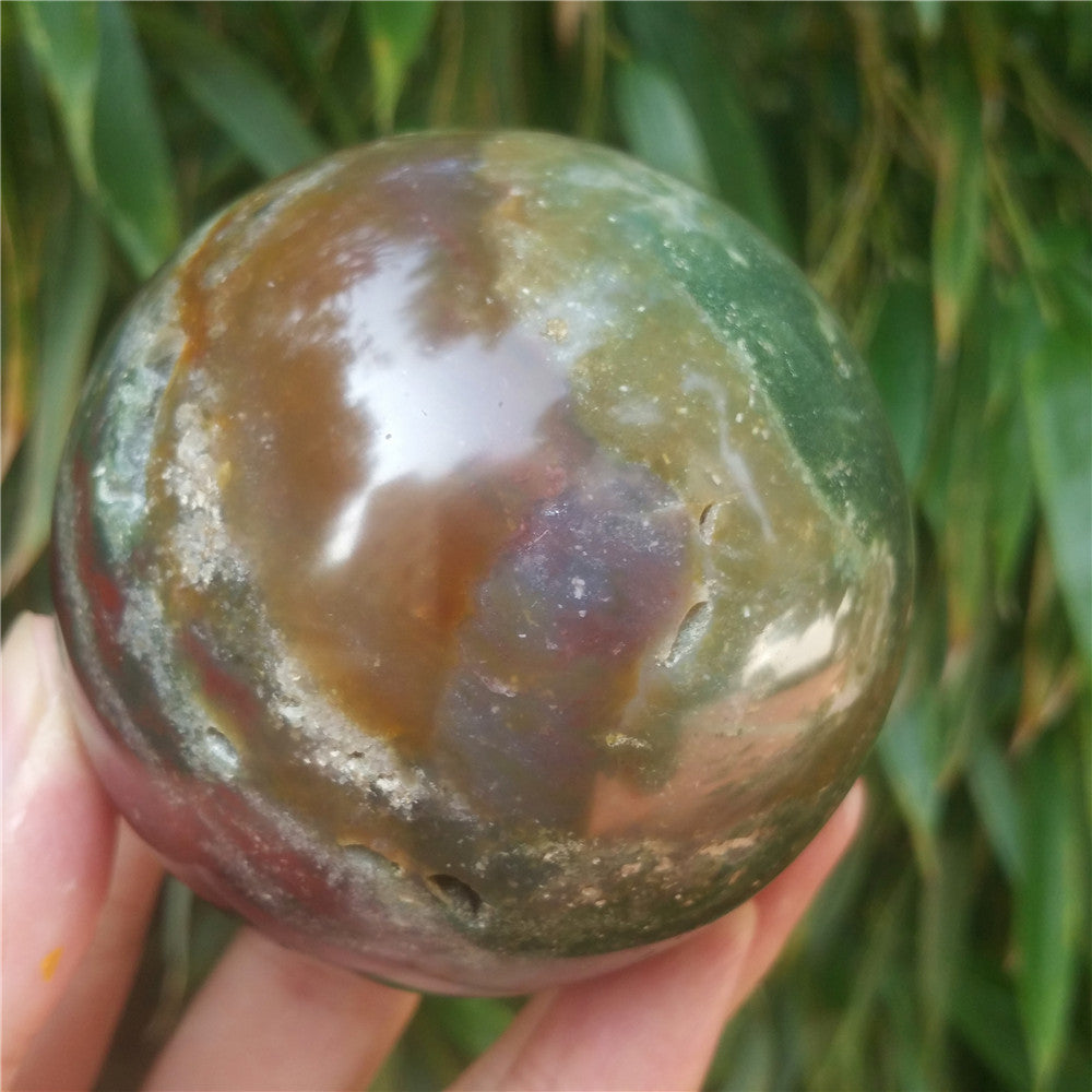Crystal carved ball of Ocean Jasper