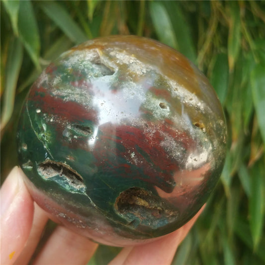Crystal carved ball of Ocean Jasper