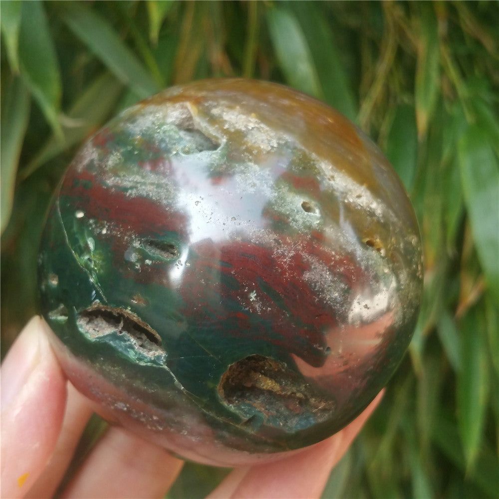 Crystal carved ball of Ocean Jasper